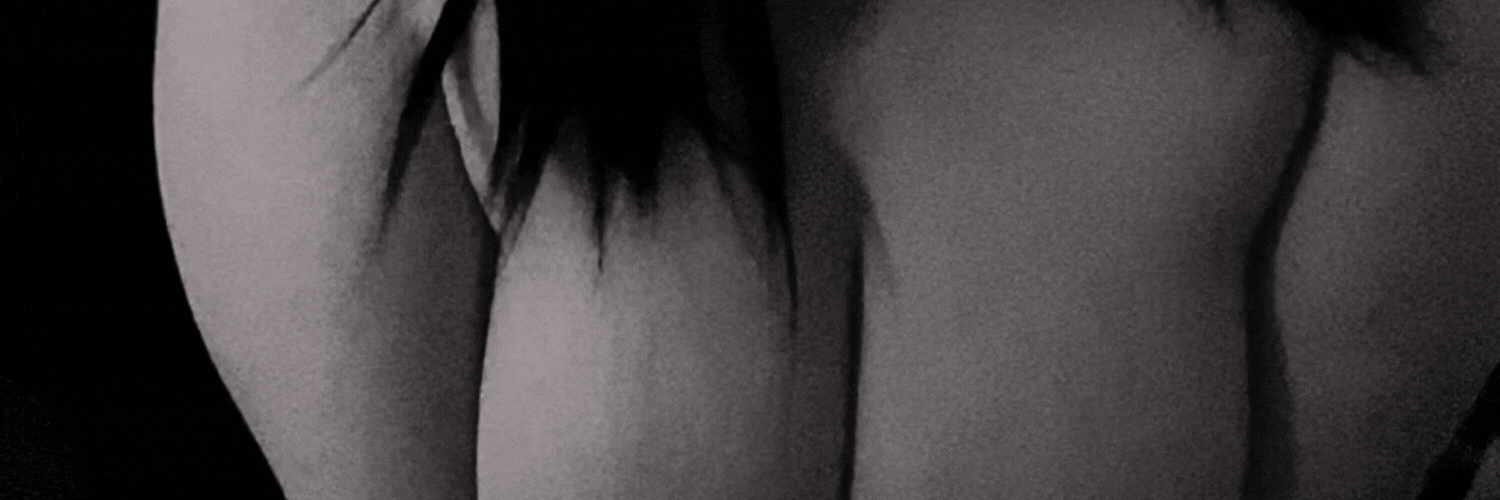 Banner gif with background of cleavage in black and white, reading Mmmm Maxi submissive fucktoy slut