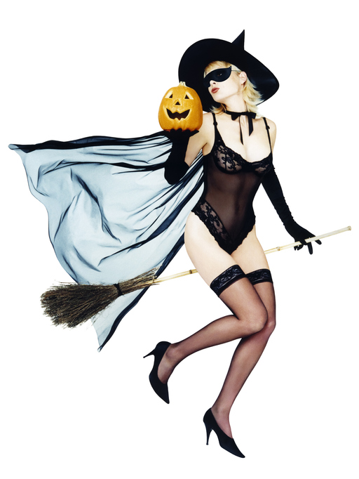 Sexy woman dressed as a witch and holding a pumpkin